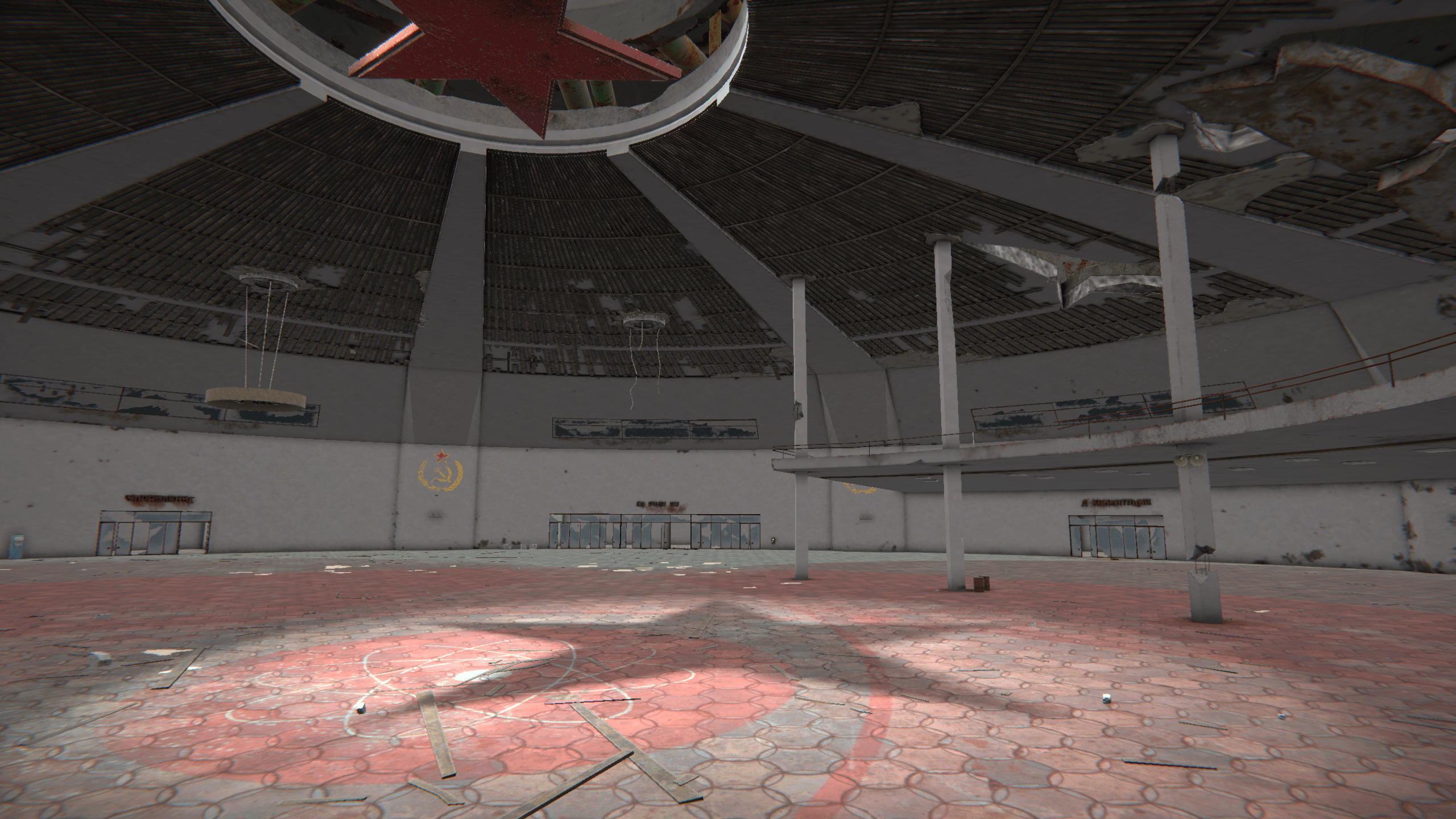 Screenshot from NODE: The Last Favor of the Antarii by Lapsus Games | Made with Unity. A 3D environment of a wide-open industrial space. A red star on the ceiling casts a shadow on the ground, which is tiled in red hexagons.